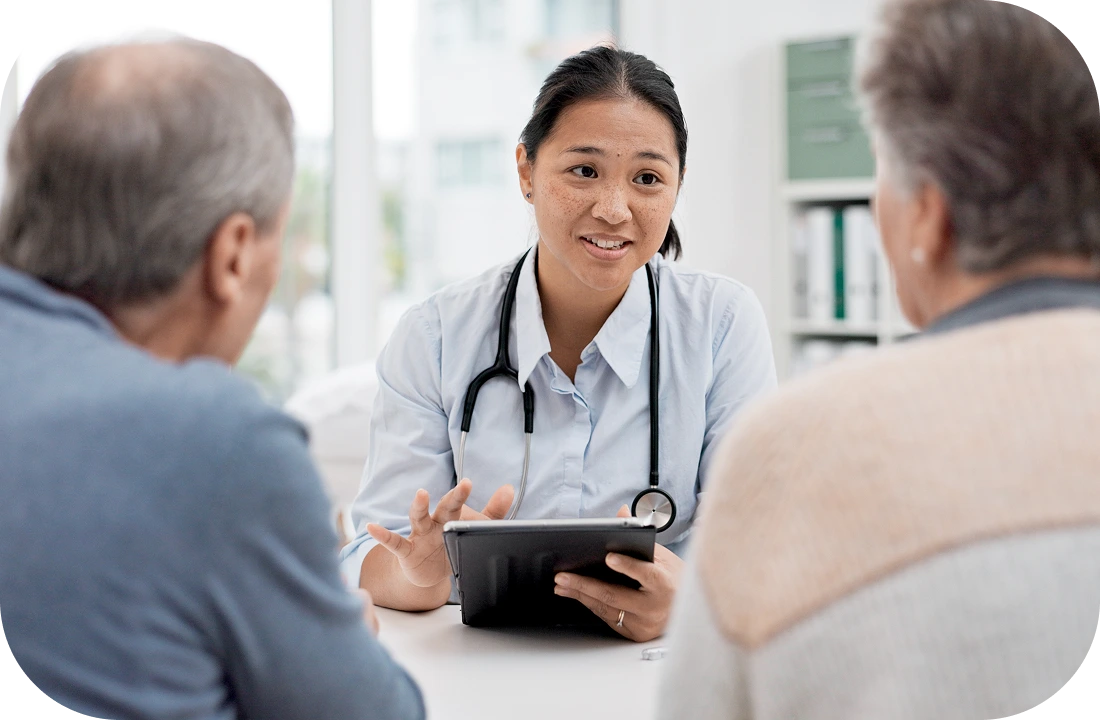 Veterinarian discussing with pet owners